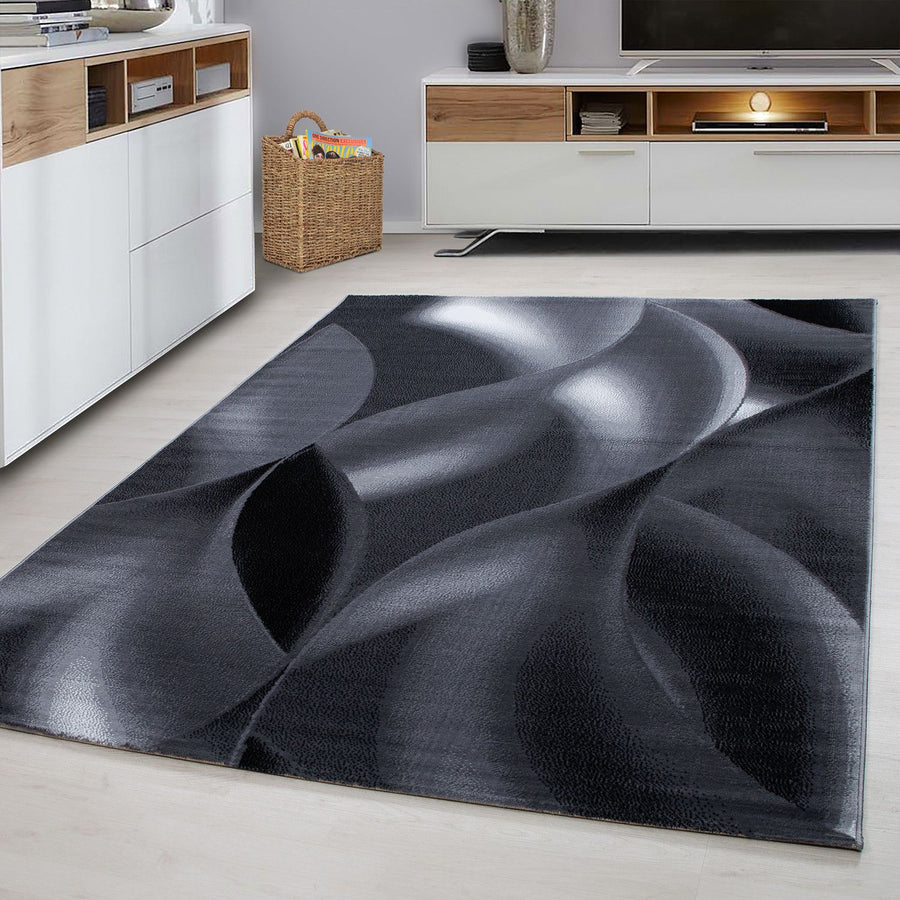 Plus Abstrakter Kurzflorteppich in Schwarz mit Wellen